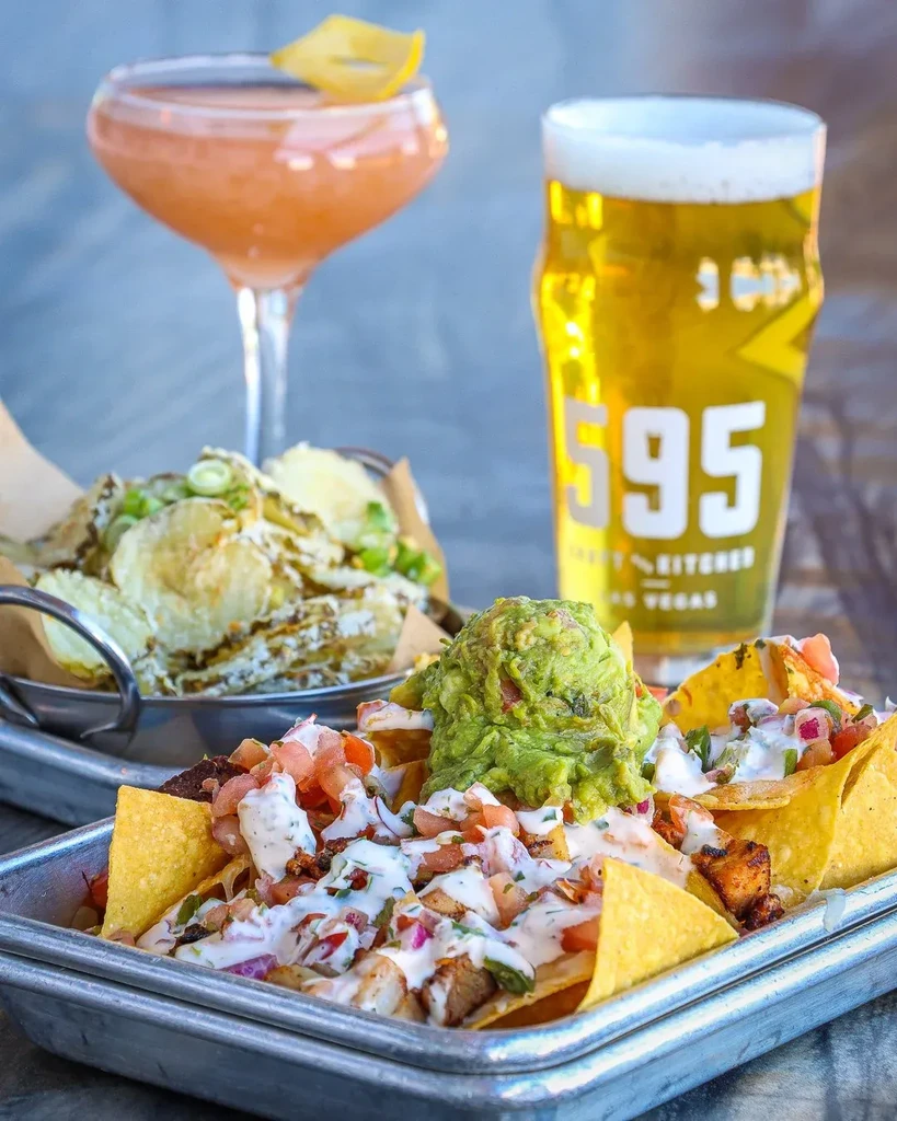 Loaded nachos, crispy chips, beer, and a cocktail close-up.