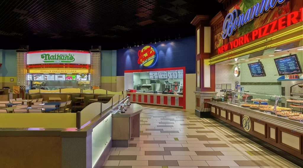 Modern food court with Nathan's Famous, Johnny Rockets, and Bonanno's Pizzeria.