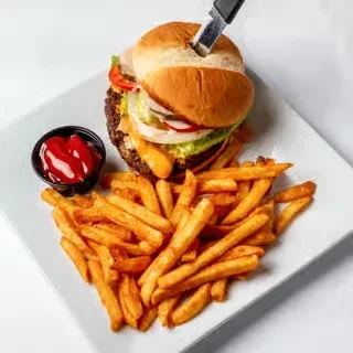A classic burger, french fries, and ketchup on a white plate.