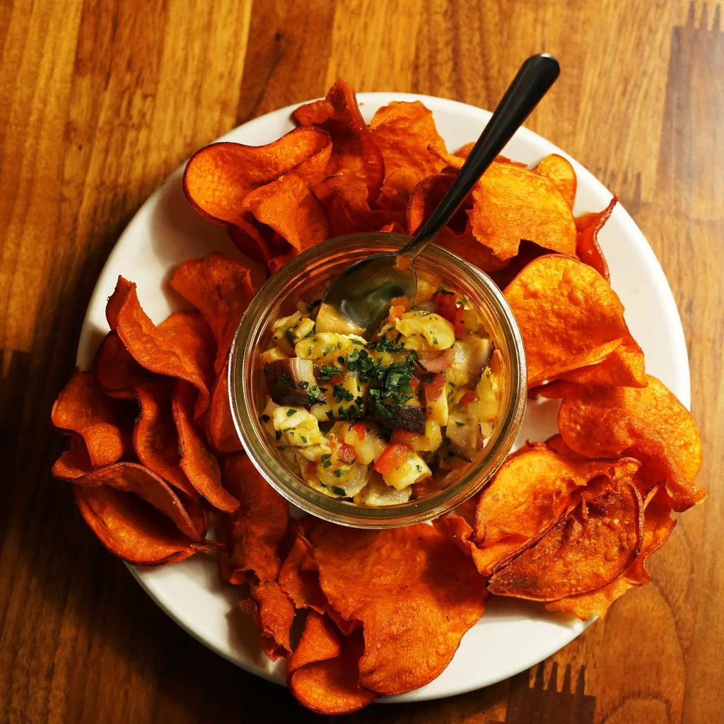 Diced seafood ceviche with orange sweet potato chips.