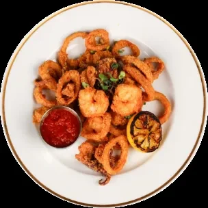 Crispy fried calamari and shrimp with red dipping sauce and grilled lemon.