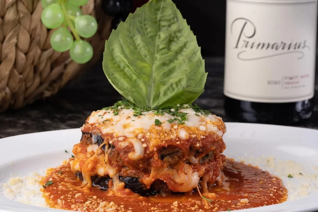 Layered eggplant parmesan with mozzarella, basil, and Pinot Noir.