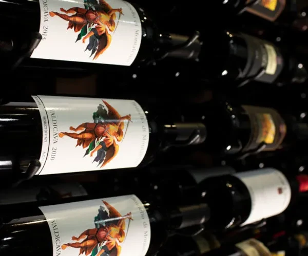 Stacked dark Valdicava wine bottles with angel labels, 2013 and 2010 vintages.