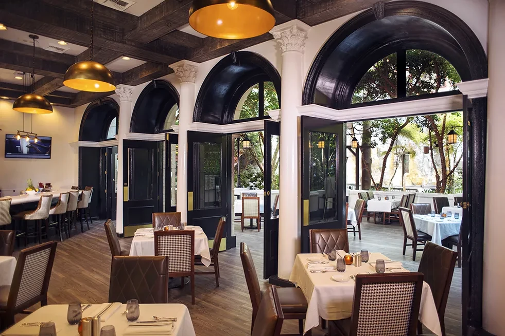 Spacious upscale restaurant featuring elegant indoor and outdoor dining.