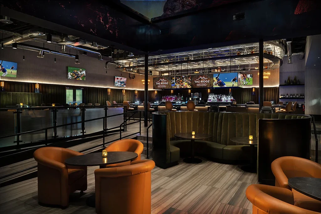 Empty "THE RIDGE BAR & GRILL" interior, upscale seating and bar.