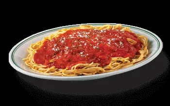 Spaghetti with red sauce, grated cheese, on green-rimmed plate, black background.