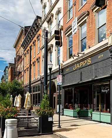 JAPP'S building with outdoor dining on a clear city street.