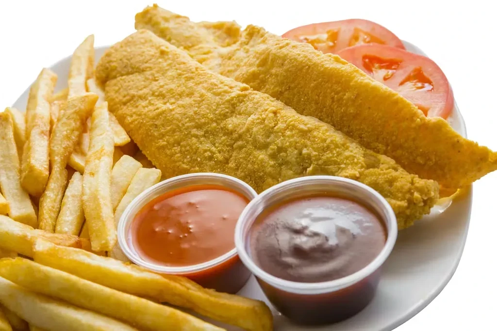 Golden-brown fish fillets, crispy fries, and sauces on a white plate.