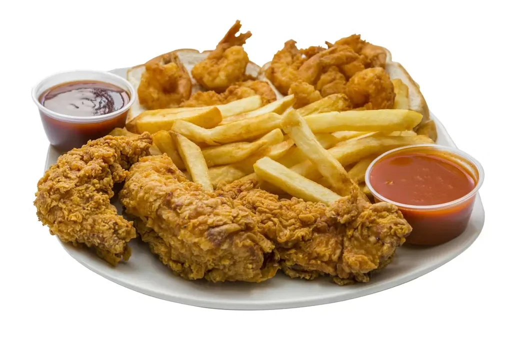 Platter of fried chicken, french fries, and shrimp with dipping sauces.