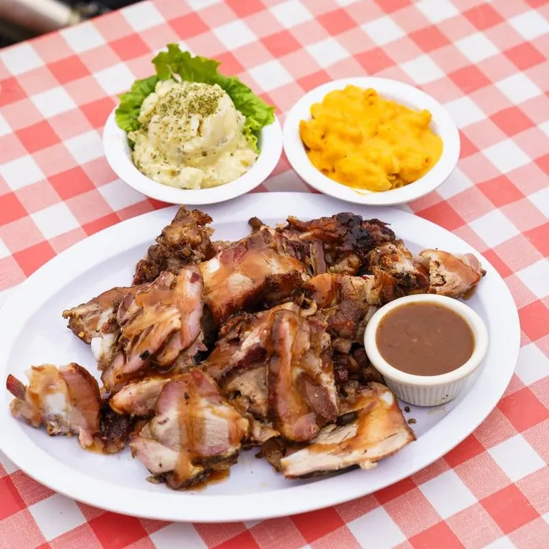 Platter of chopped meat, potato salad, and macaroni and cheese.