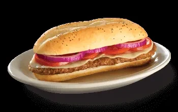 Poppy seed bun submarine sandwich with meat, cheese, tomato, onion.