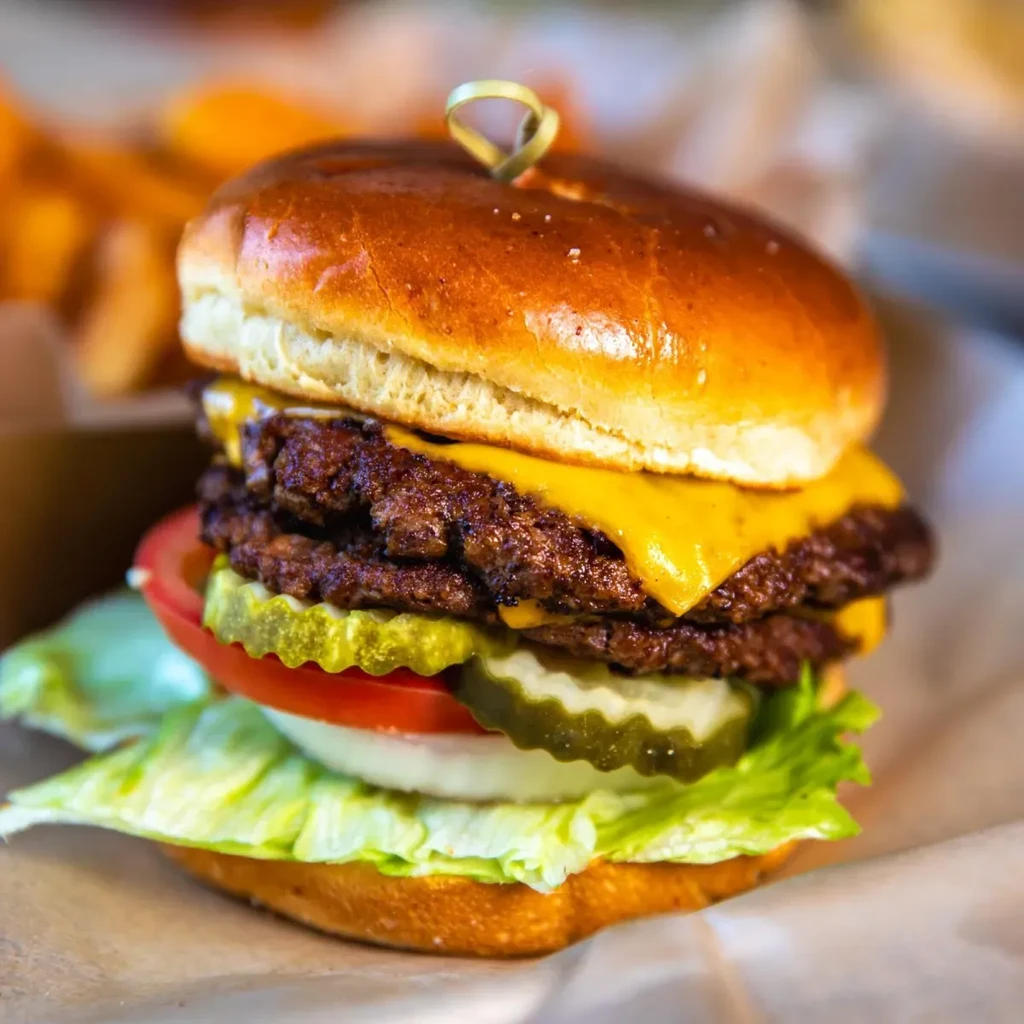 Double cheeseburger, melted cheese, lettuce, tomato, onion, pickles.