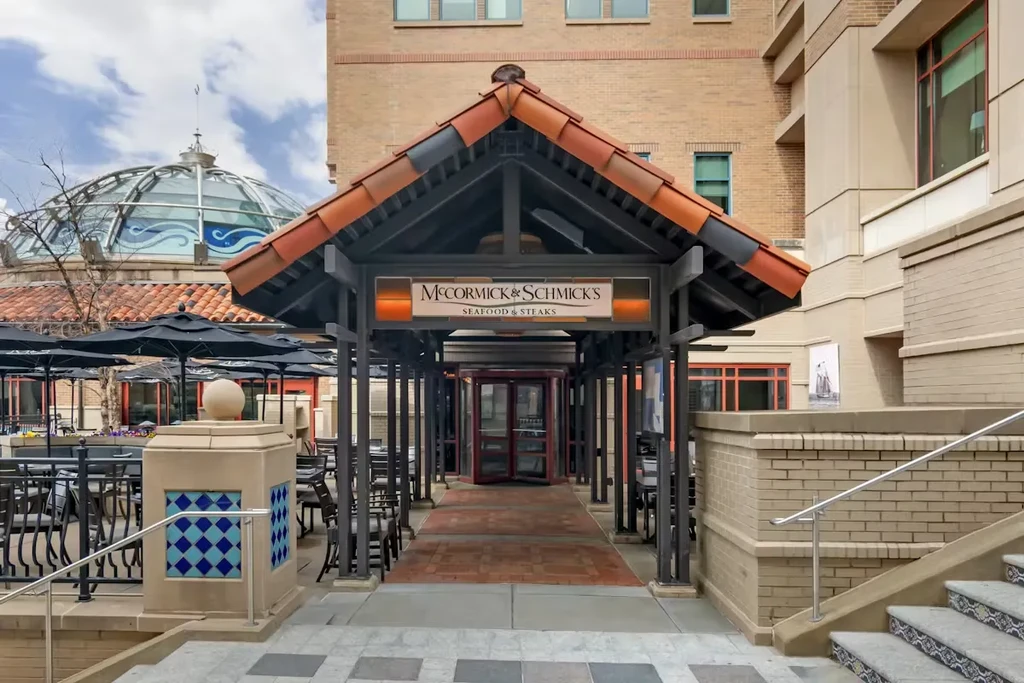 McCormick & Schmick's restaurant entrance with covered walkway and outdoor dining.