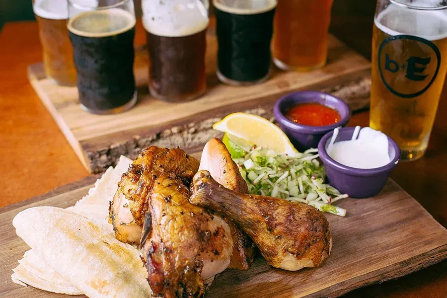 Roasted chicken, tortillas, slaw, sauces, and craft beer flight.