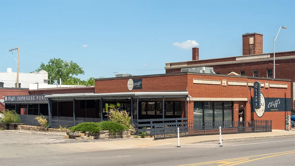 Cliff's Taphouse: red brick building with outdoor patio on a sunny day.