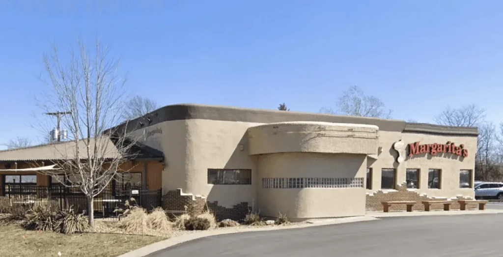 Margarita's restaurant exterior with stucco, brick, curved walls, and patio.