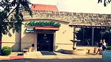 Daylight exterior of Margarita's Mexican Bar & Grill with fountain.