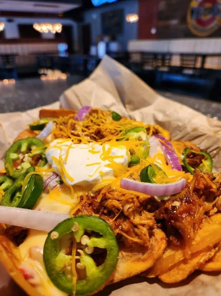 Waffle fries loaded with pulled pork, melted cheese, jalapeños, and onion.