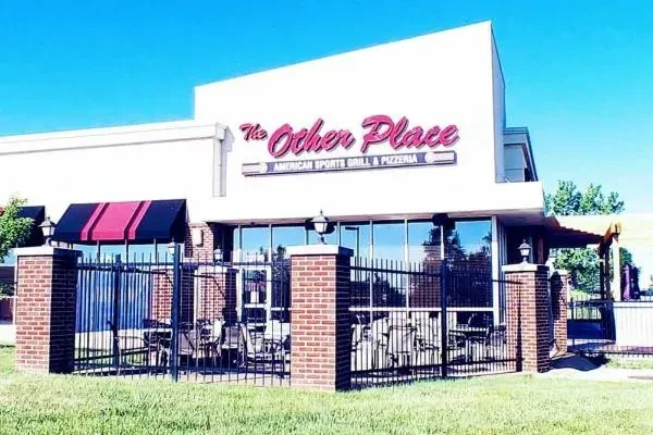 The Other Place, a white American Sports Grill with outdoor patio.