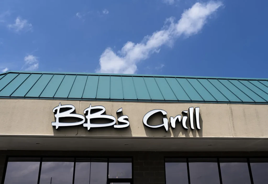 BB's Grill building exterior, sign, teal roof, and blue sky.