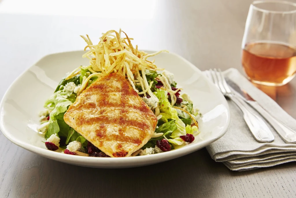 Grilled chicken, blue cheese salad, cranberries, crispy potato garnish.