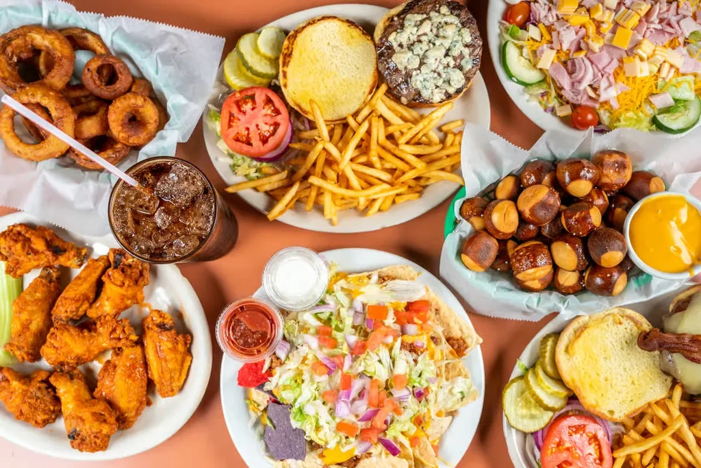 Diverse spread of classic American comfort food on a brown table.