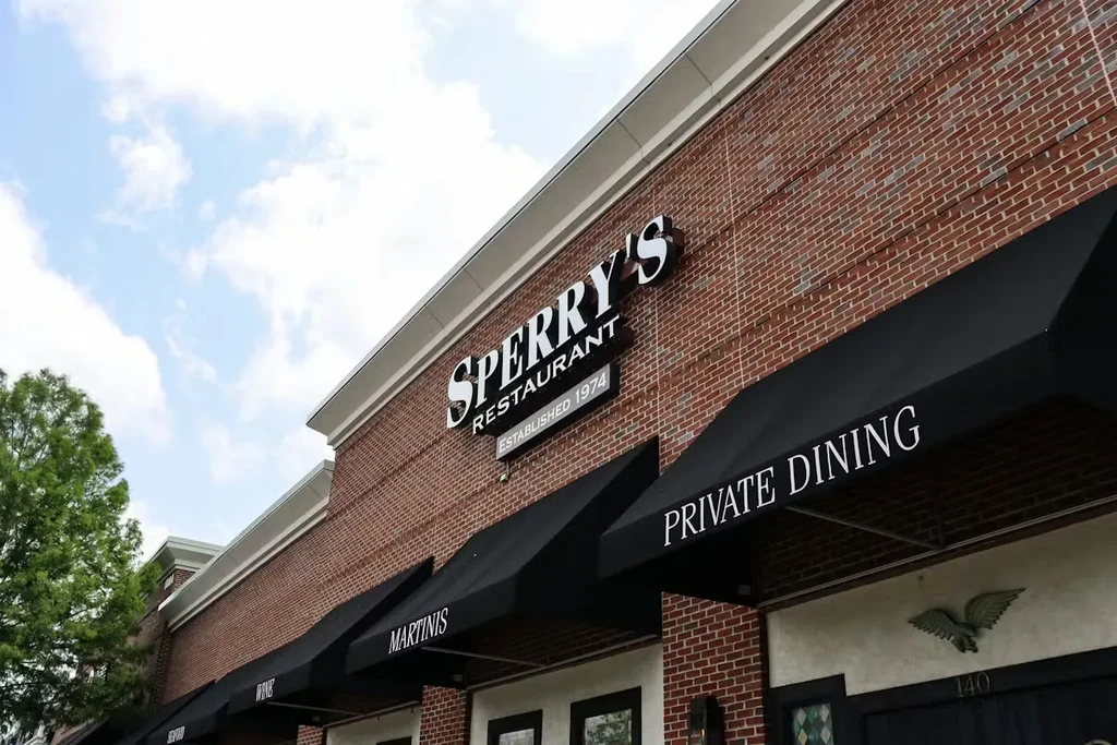 Sperry's Restaurant brick exterior, "Martinis" and "Private Dining" awnings.