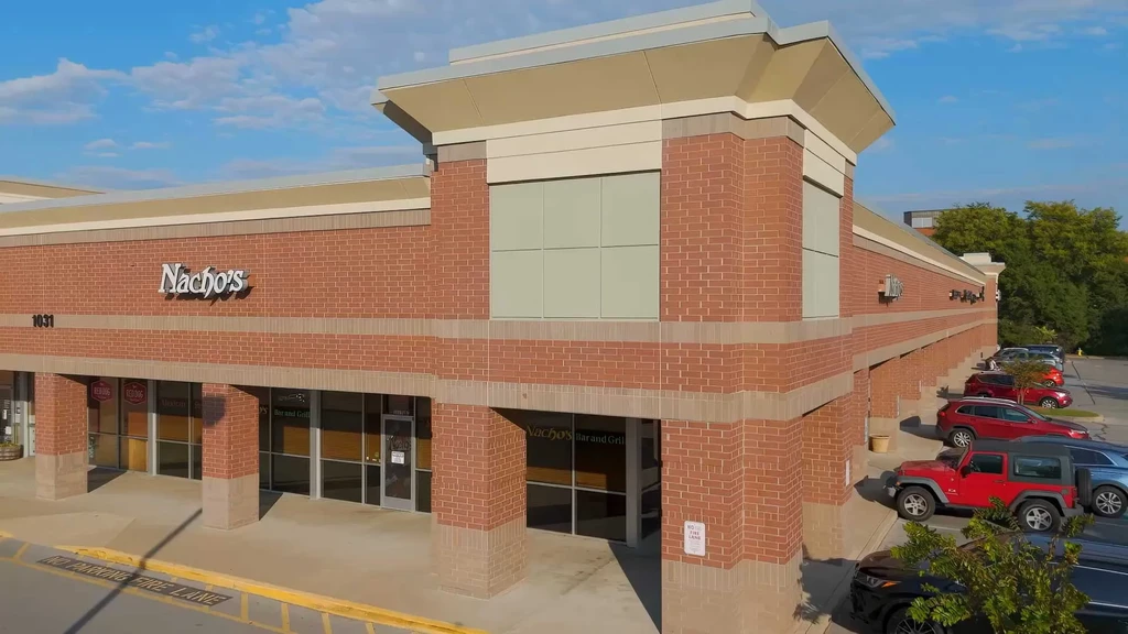 Elevated view of Nacho's Bar and Grill storefront and parking lot.