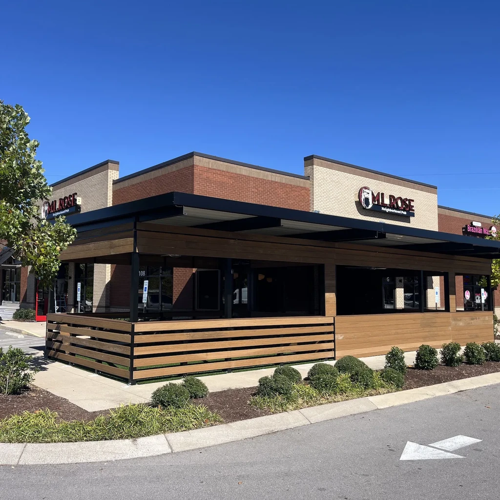 ML ROSE Neighborhood Pub exterior: modern brick building with extensive patio.