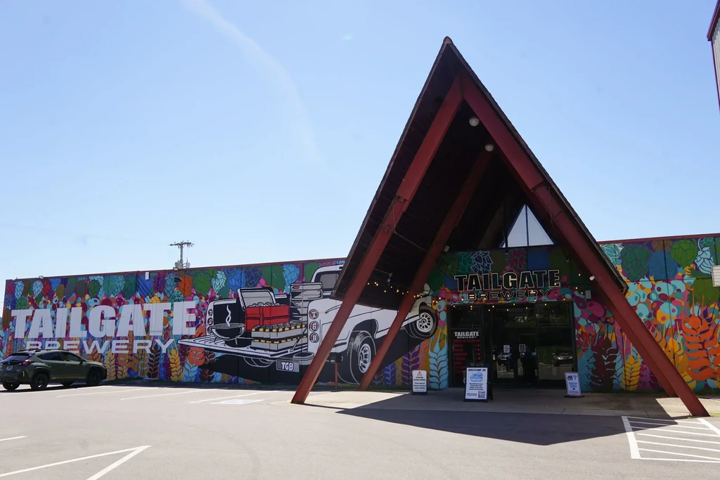 Colorful mural of vintage truck tailgate on Tailgate Brewery building.