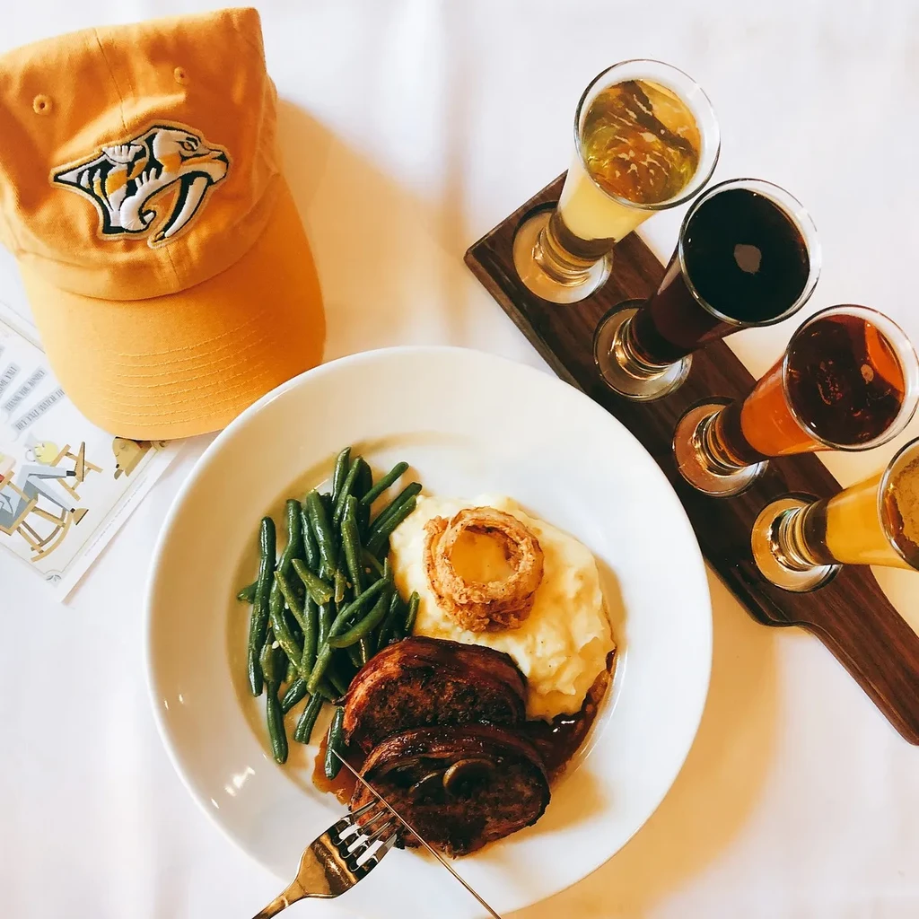 Meatloaf meal, mashed potatoes, beer flight, and Predators cap.