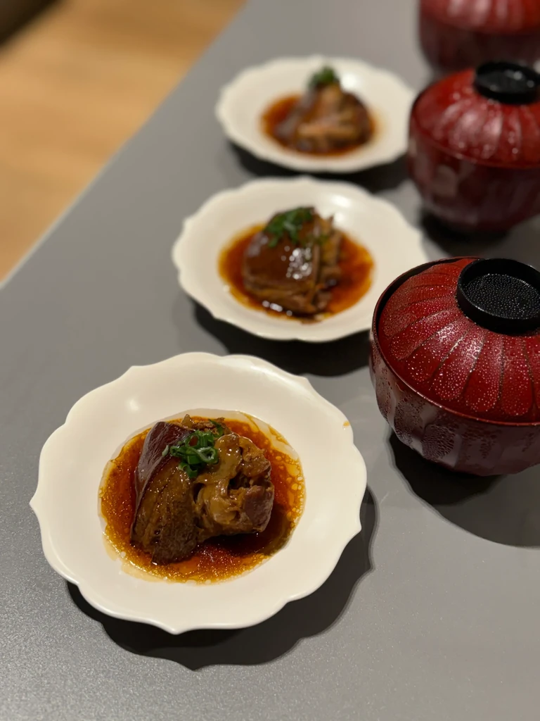 Three braised pork dishes in white plates with two red bowls.