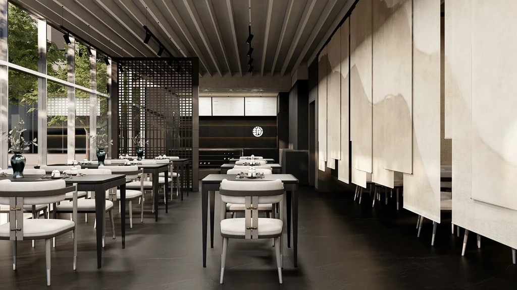 A modern, empty restaurant with a minimalist design featuring dark tables and light chairs.