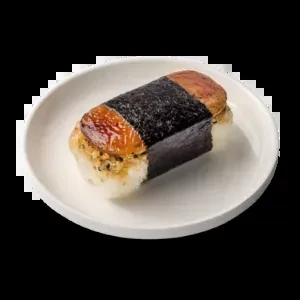 A grilled Spam musubi on a white plate, black background.