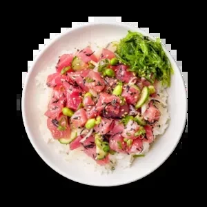 Close-up poke bowl with tuna, rice, edamame, cucumbers, and seaweed.