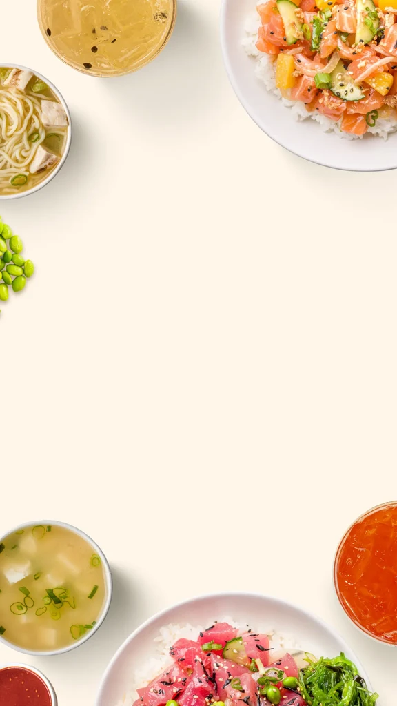 Top-down view of multiple Asian dishes and drinks on an off-white background.