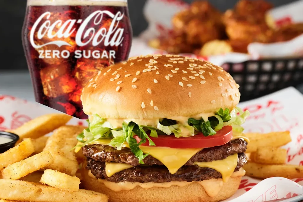 Double cheeseburger, french fries, dipping sauce, and Coca-Cola Zero Sugar drink.