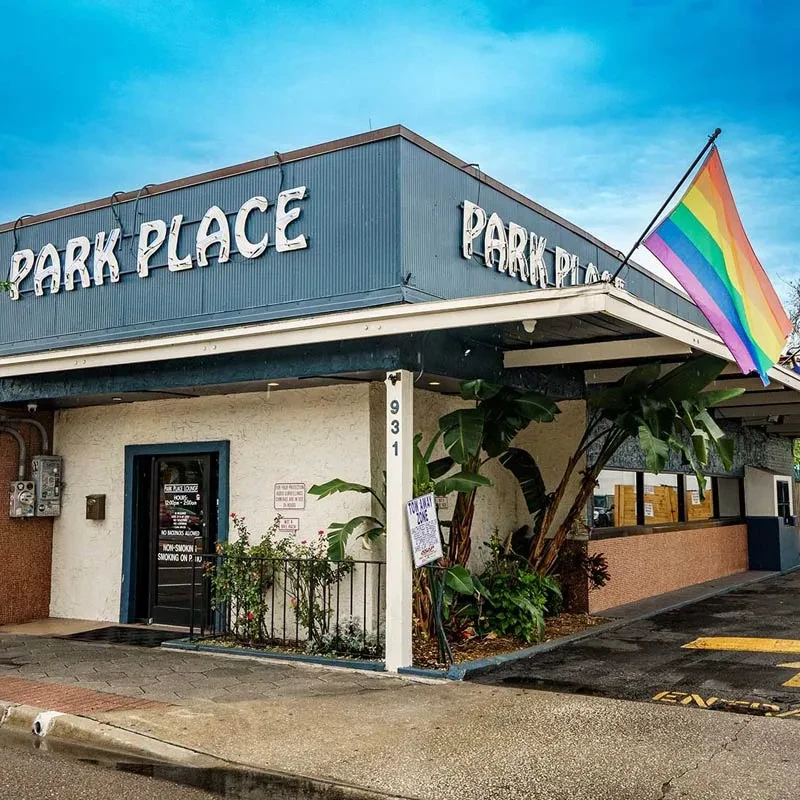 PARK PLACE building, blue upper section, flying rainbow pride flag.