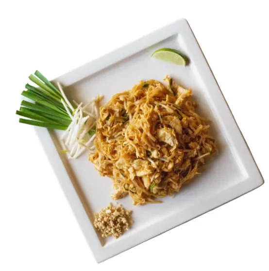 Well-plated stir-fried noodles with chicken, egg, lime, and peanuts.
