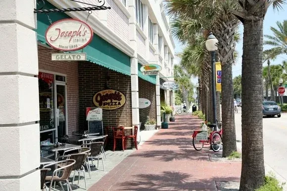 Joseph's Italian restaurant exterior with patio, gelato, and pizza signs.