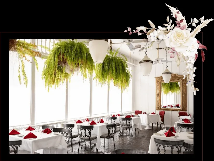 Bright restaurant dining area with hanging ferns and set tables.