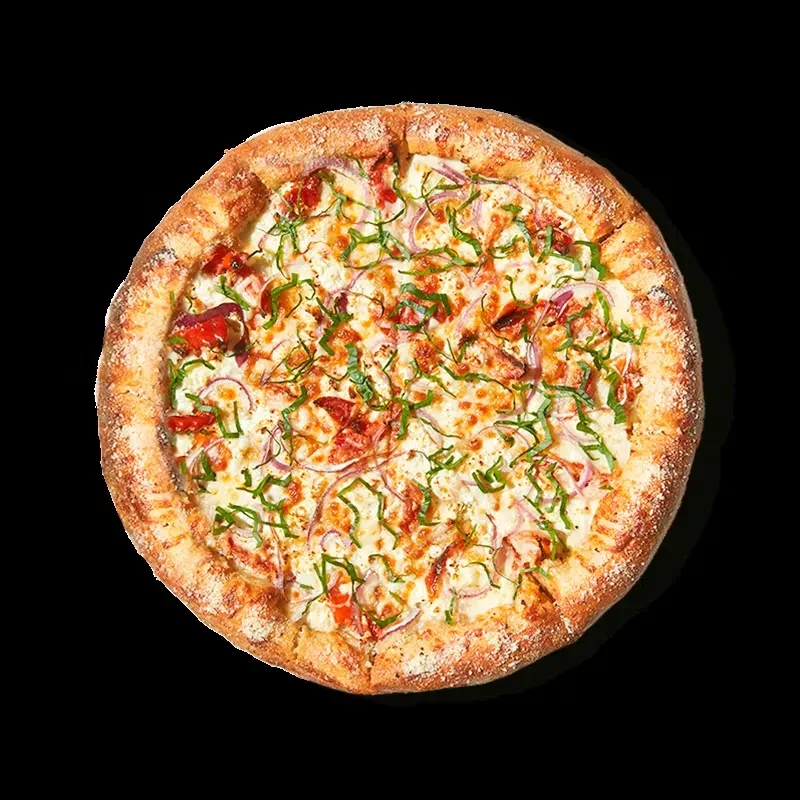 Overhead shot of a whole pizza with cheese, red toppings, onions, and basil.