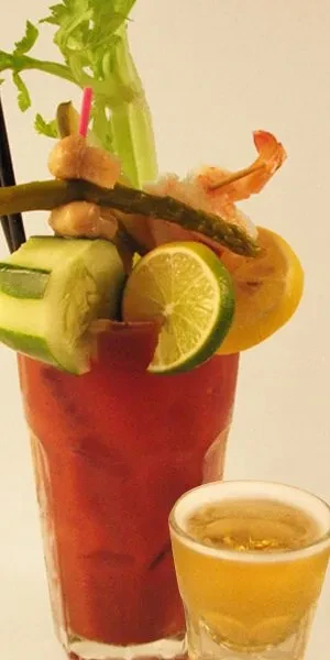 A towering, elaborately garnished Bloody Mary with a beer chaser.
