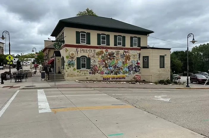 Two-story A.J. O'Brady's building with colorful mural and outdoor patio.