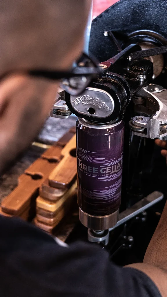 Purple Three Cellar can sealed by an Automatic Master-Sealer.