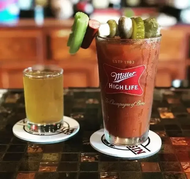 Miller High Life Bloody Mary, heavily garnished, with a small shot.
