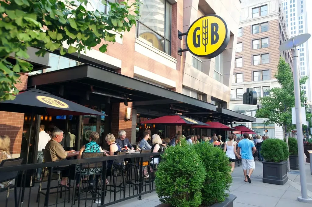 G&B restaurant exterior with a busy patio of people dining.