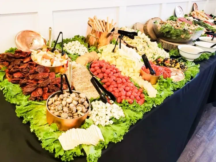 A vibrant, extensive buffet spread with various fresh salads and appetizers.