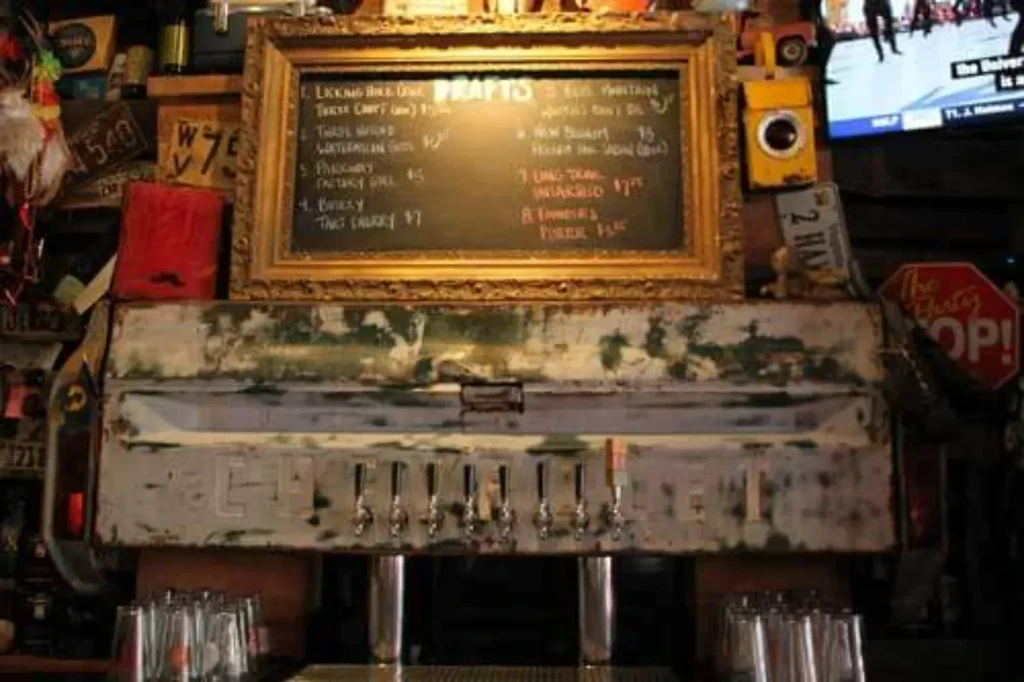 Rustic bar features draft beer taps built into a vintage truck tailgate.
