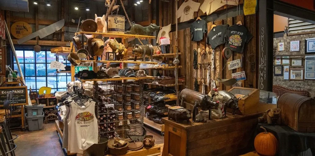 Rustic gift shop displaying barbecue merchandise, decor, and a butcher knife.